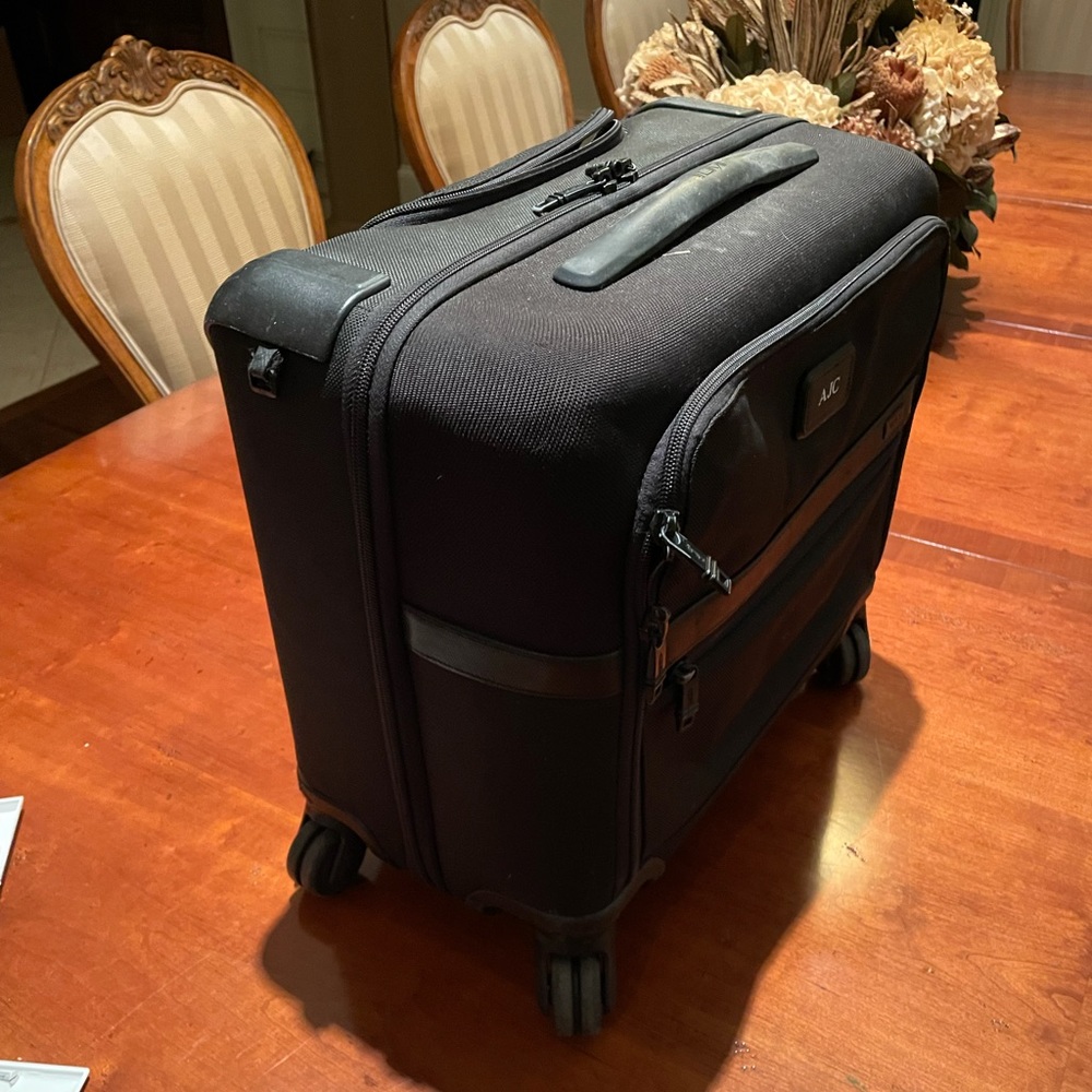 Tumi 4 wheeled briefcase